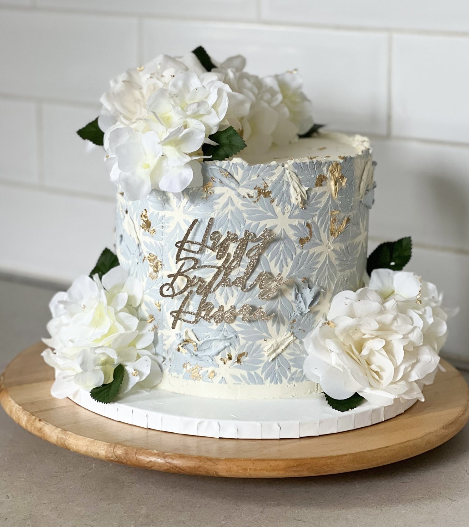 Blue patterned celebration cake.